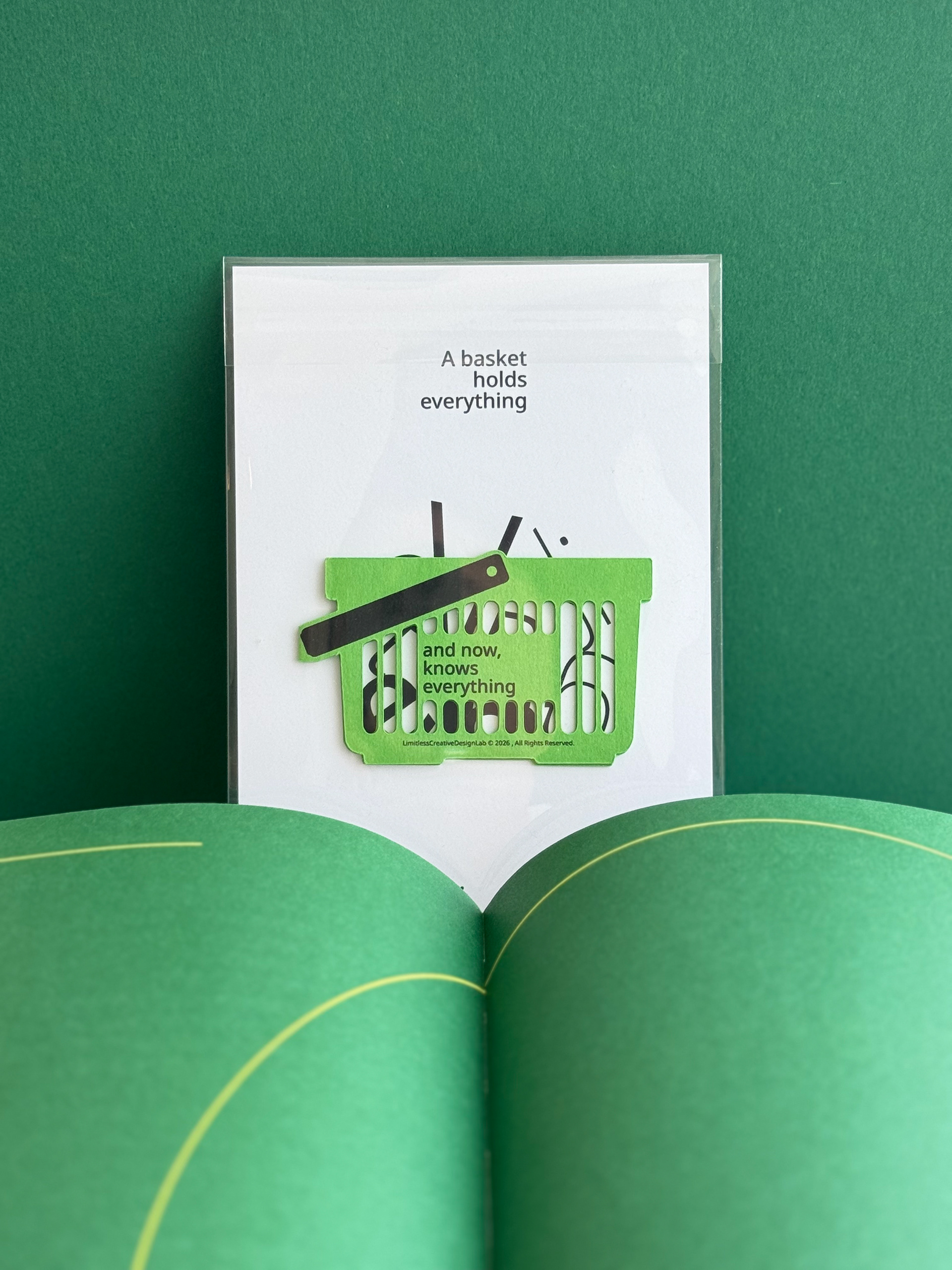 A green shopping-basket bookmark.
