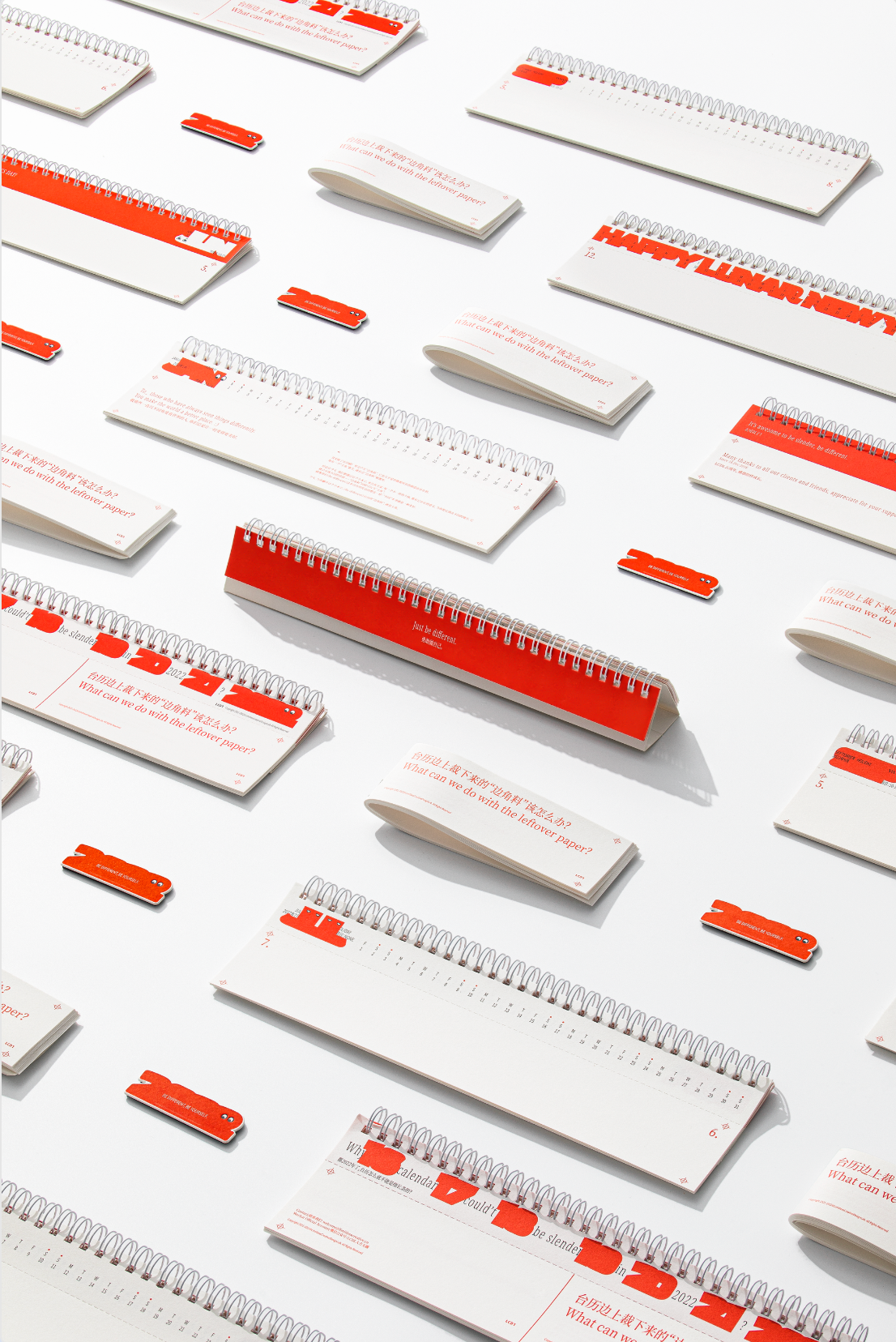 Be Different New Year gifts and printed pieces neatly arranged.