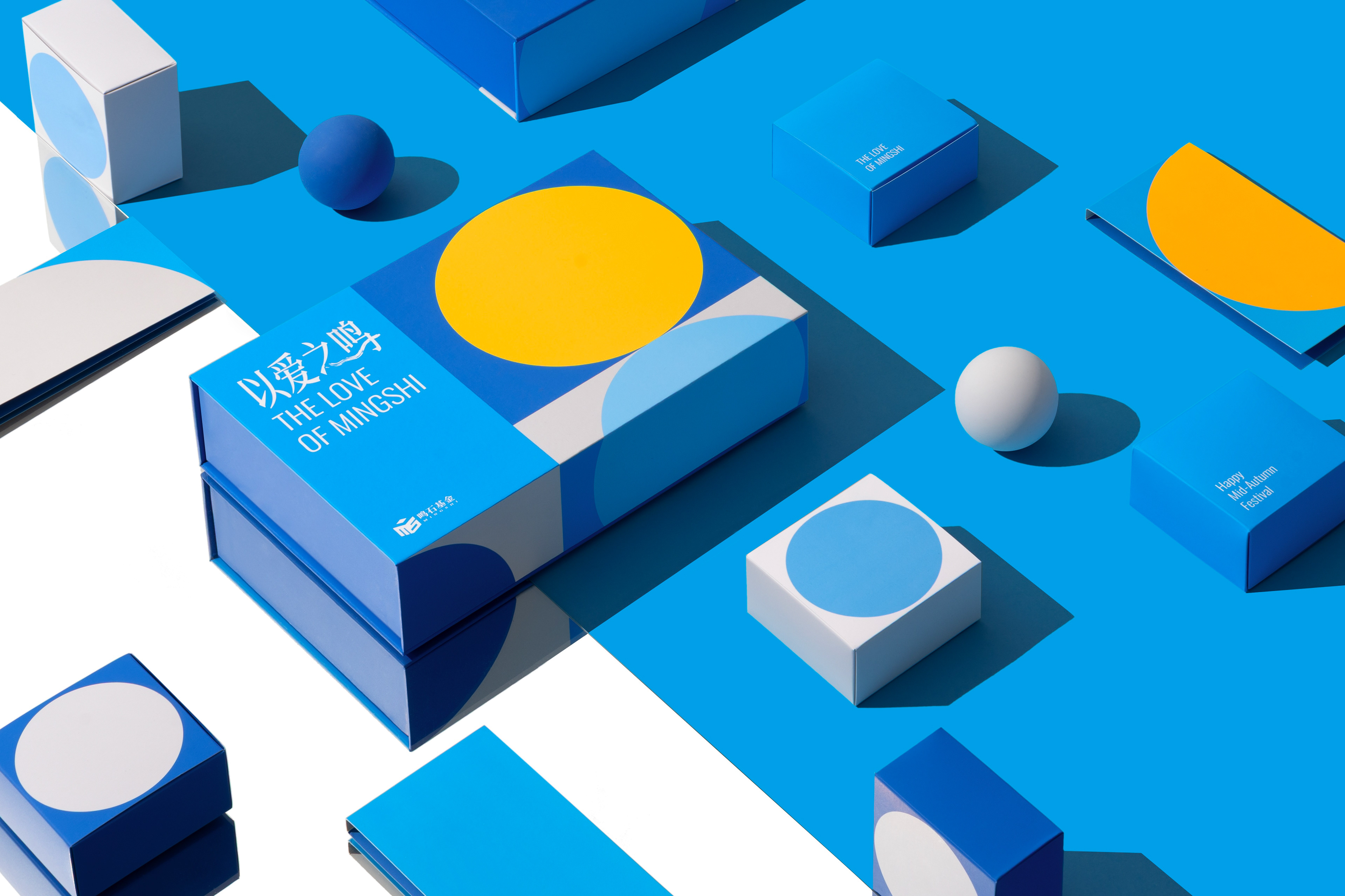 Blue 2025 Love of Mingshi gift packaging with moon, semicircle and geometric props.